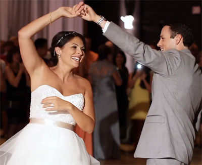 Gina and Craig twirl in their wedding dance